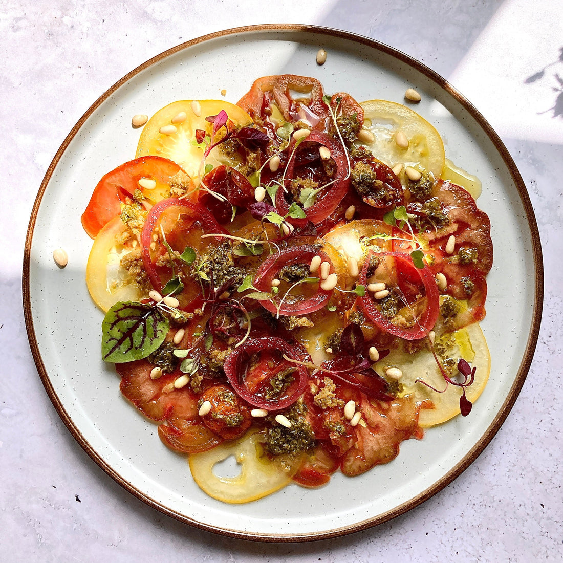 Beef tomato carpaccio with green olives tapenade Cole & Mason UK