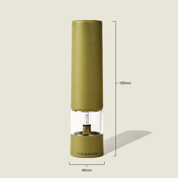 The Brixton Electric Mill Olive Green GS by Cole & Mason is a tall electric salt and pepper mill featuring a transparent midsection for easy viewing. Designed for convenient one-handed use, it is equipped with a durable ceramic grinder. Measuring 185mm in height with a 46mm base diameter, the mill stands on a light background with a faint shadow.