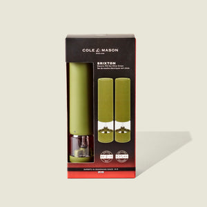 Cole & Mason Brixton Electric Mill Olive Green GS set, displayed in packaging with two mills visible through a front clear window. Designed for easy one-handed operation and equipped with robust ceramic grinders, the box features black and red accents along with white text.