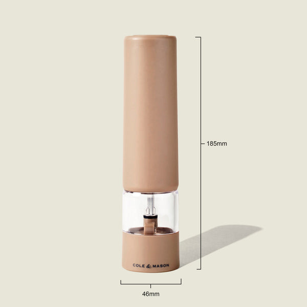 The Brixton Electric Mill Stone GS by Cole & Mason is a tan electric pepper grinder featuring a ceramic grinding core and a transparent midsection, with the COLE & MASON branding displayed. It stands upright at 185mm tall and 46mm wide on a plain light background. The adjustable grind setting allows you to precisely customize your seasoning to taste.