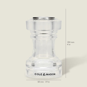 The Cole & Mason Acrylic Salt Shaker & Pepper Mill Set, measuring 104 mm (4 in) tall and 50 mm (1.9 in) wide, is shown upright on a neutral background. This versatile adjustable set serves as both a salt shaker and pepper mill to meet your kitchen needs.