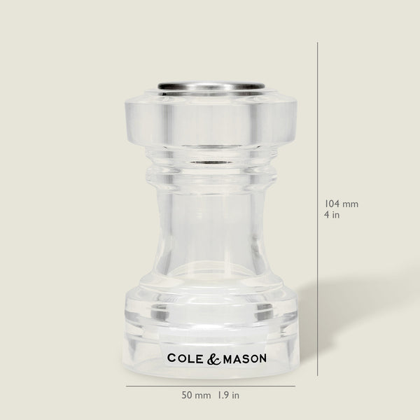 The Cole & Mason Acrylic Salt Shaker & Pepper Mill Set, measuring 104 mm (4 in) tall and 50 mm (1.9 in) wide, is shown upright on a neutral background. This versatile adjustable set serves as both a salt shaker and pepper mill to meet your kitchen needs.